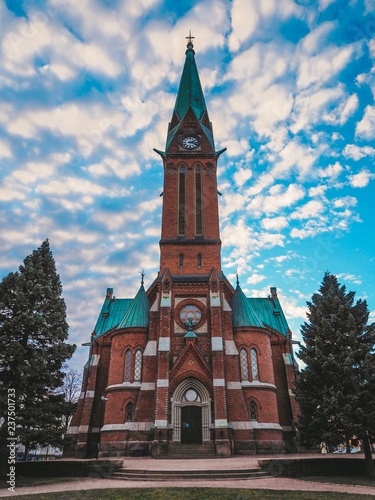Facade of the old Catholic Gothic brick Cathedral in Finland in Kotka