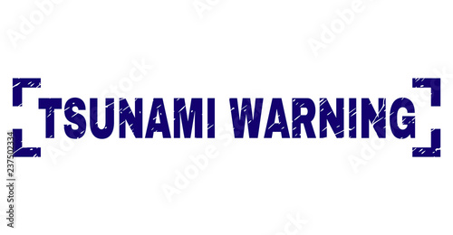 TSUNAMI WARNING tag seal stamp with corroded texture. Text tag is placed inside corners. Blue vector rubber print of TSUNAMI WARNING with dust texture.