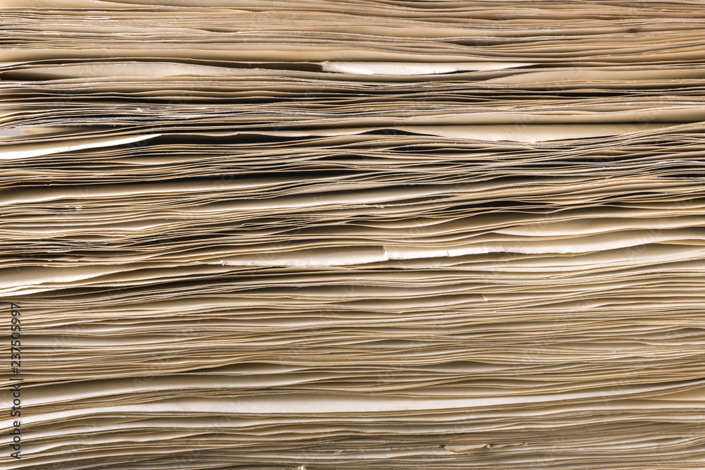 custom made wallpaper toronto digitalSide view of stack of old yellowed paper, closeup view.