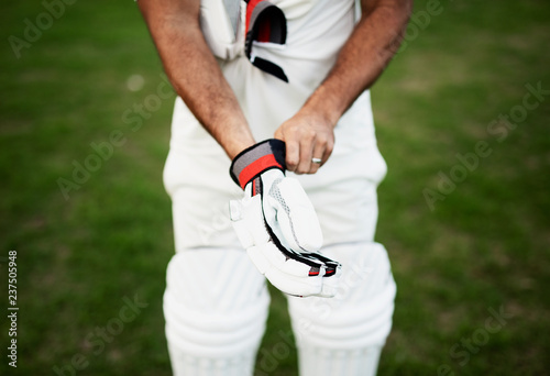 Cricket player getting ready to play