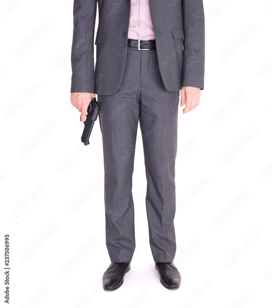 Man in suit with gun Man in suit with gun