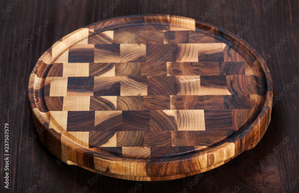 Wooden cutting Board on dark background. Top view
