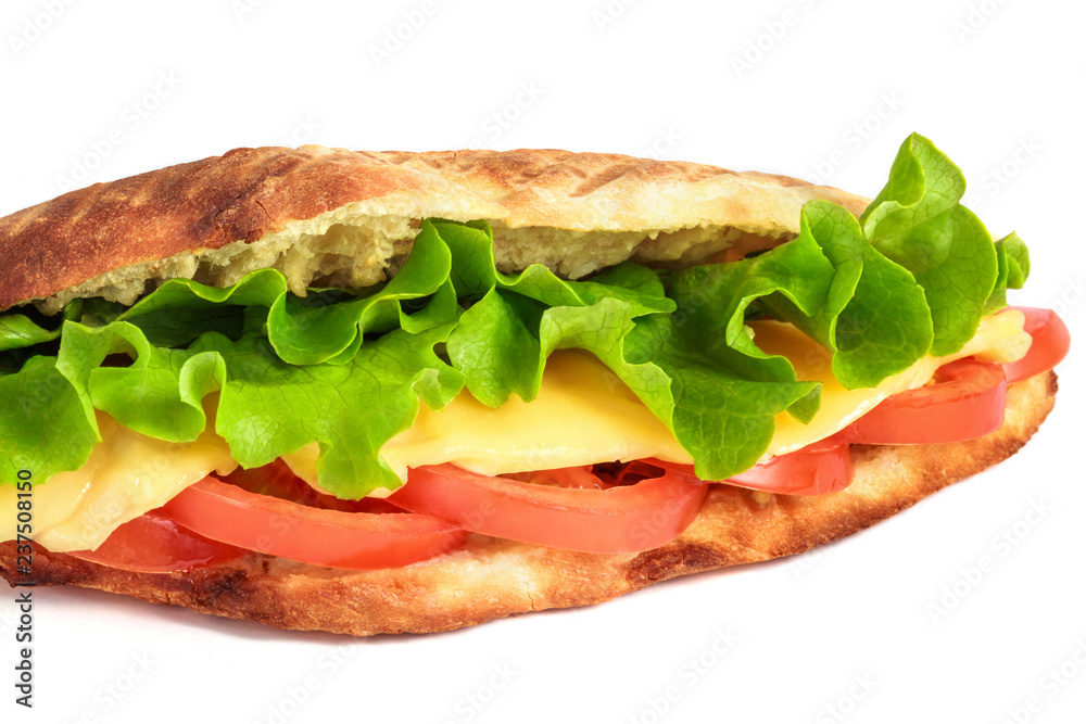 Sandwich from fresh pita bread with lettuce, slices of fresh tomatoes, ham pork and cheese on white background Sandwich from fresh pita bread with lettuce, slices of fresh tomatoes, ham pork and cheese on white background