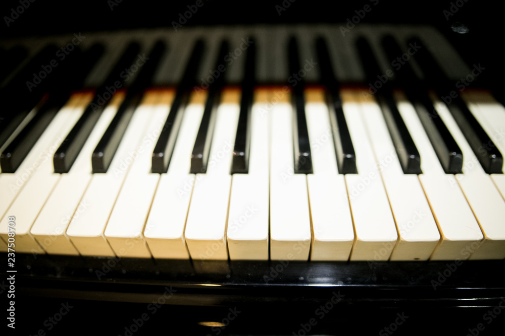 Man hands playing piano. Classical music. Art and abstract background. Asian man pianist. Top view. Dark vignette. Man hands playing piano. Classical music. Art and abstract background. Asian man pianist. Top view. Dark vignette.