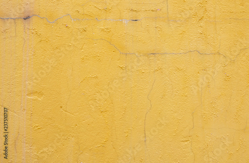 Yellow concrete wall texture and background