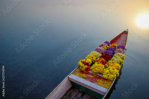 Flowers on boat, left space for text