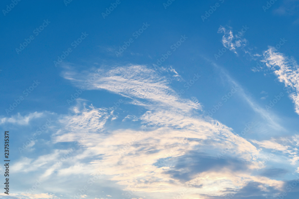 Blue sky with white clouds background. Air clouds in the beautiful sky.