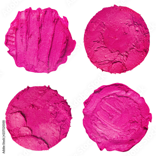 Collection of smudged lipstick swatches isolated on a white background. Top view