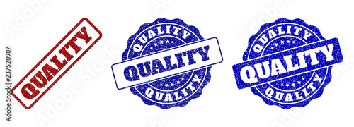 QUALITY scratched stamp seals in red and blue colors. Vector QUALITY watermarks with scratced effect. Graphic elements are rounded rectangles, rosettes, circles and text tags.
