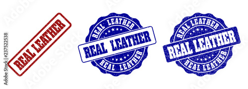 REAL LEATHER grunge stamp seals in red and blue colors. Vector REAL LEATHER labels with grainy surface. Graphic elements are rounded rectangles, rosettes, circles and text labels.