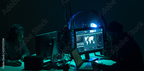 Hackers making cryptocurrency fraud using virus software and computer interface. Blockchain cyberattack, ddos and malware concept. Underground background. photo