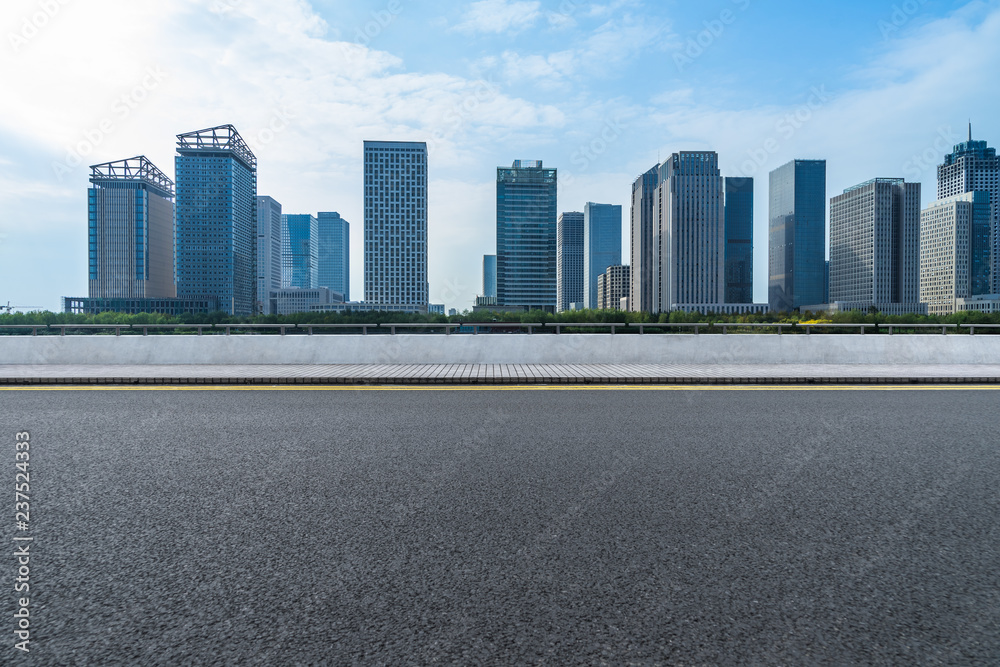 urban traffic road with cityscape in background, China. urban traffic road with cityscape in background, China.