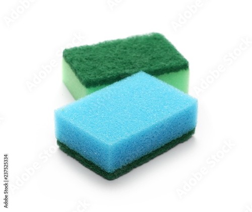 Green and blue sponges isolated on white background