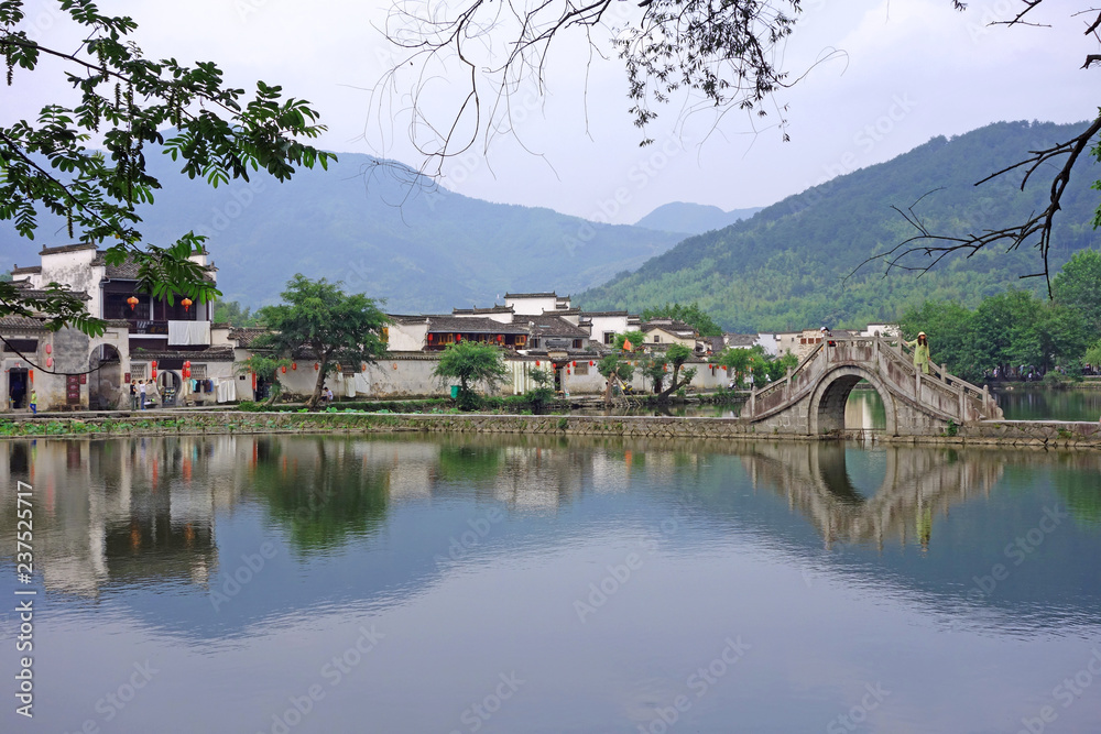 The Water Reflection of Hongcun village in morning. Hongcun Village, Anhui province, China : one of most attractive ancient village in China.