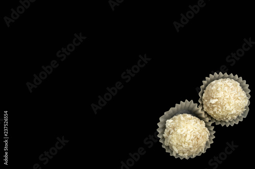 Candy sweet white cream with coconut isolate on a black background