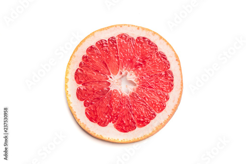 Single round sliced grapefruit  isolated on white background