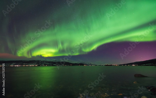 The polar arctic Northern lights aurora borealis sky star in Norway Svalbard in Longyearbyen city mountains