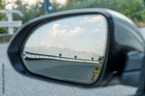 mountain road in the rearview mirror
