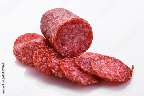 delicious sliced salami on a white background