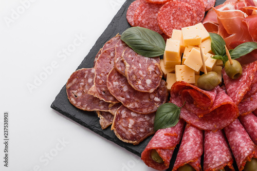 Cold smoked meat plate on a white background