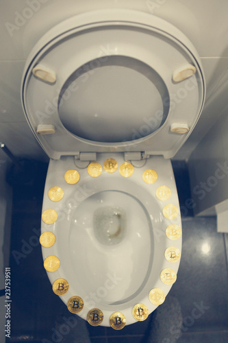 Bitcoin on the toilet. Metal Bitcoin physical currency. 