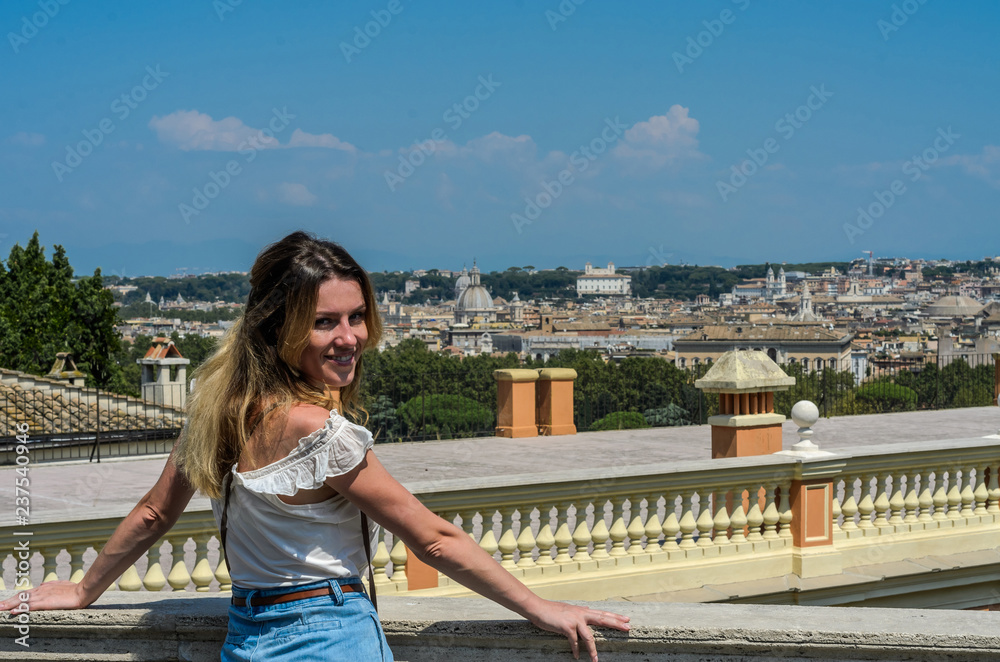 Young charming girl on the background of ancient Rome, Italy