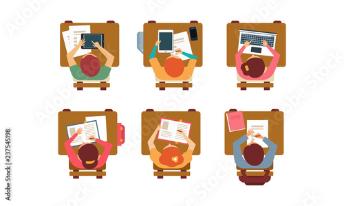 Students with books, laptops and digital tablets sitting behind desks, top view. Teenagers at classroom. Flat vector design