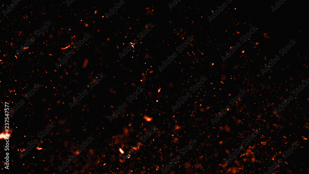 Fire effect dust debris isolated on black background, motion powder spray burst in dark texture - obrazy, fototapety, plakaty 