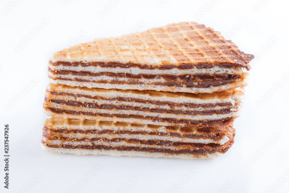 waffle sandwiches with boiled condensed milk isolated on white background. waffle sandwiches with boiled condensed milk isolated on white background.