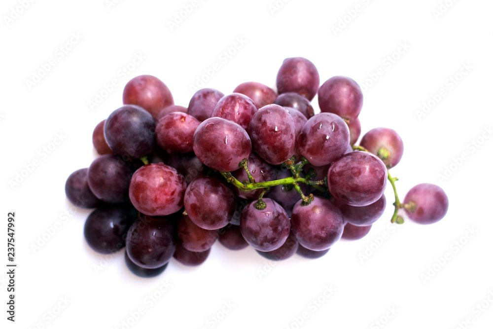 Bunch of purple grapes on a white backdrop. Bunch of purple grapes on a white backdrop.