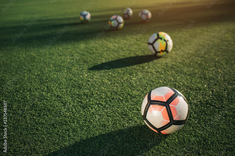 Picture of six balls on lawn field. They lying without move. Sun is shining outside. Picture of six balls on lawn field. They lying without move. Sun is shining outside.