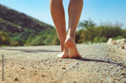 barefoot feet on the road photo