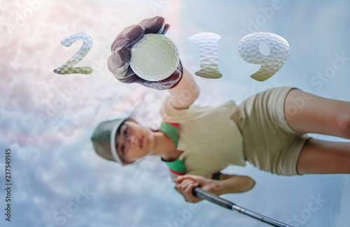 incoming year 2019, prepare by hand of woman golfer on the green,  successfully on occusion of Happy new year and merry Christmas on golf course photo