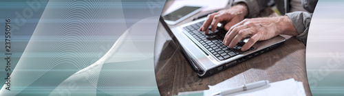 Businessman working on laptop. panoramic banner