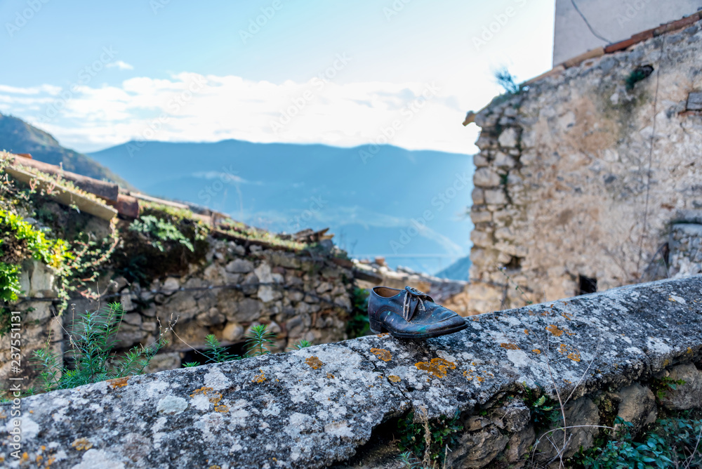 An Old Shoe on a wall and a View in the Mountains of Southern Italy