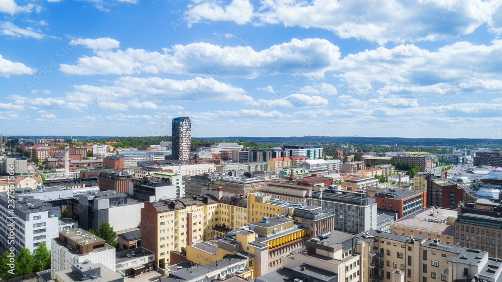 Beautiful panorama of the Tampere city at sunny summer day. Blue sky and beautiful clouds.