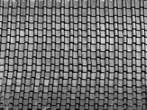 black and white tile roof with light and shadow pattern