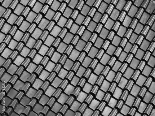 black and white tile roof with light and shadow pattern