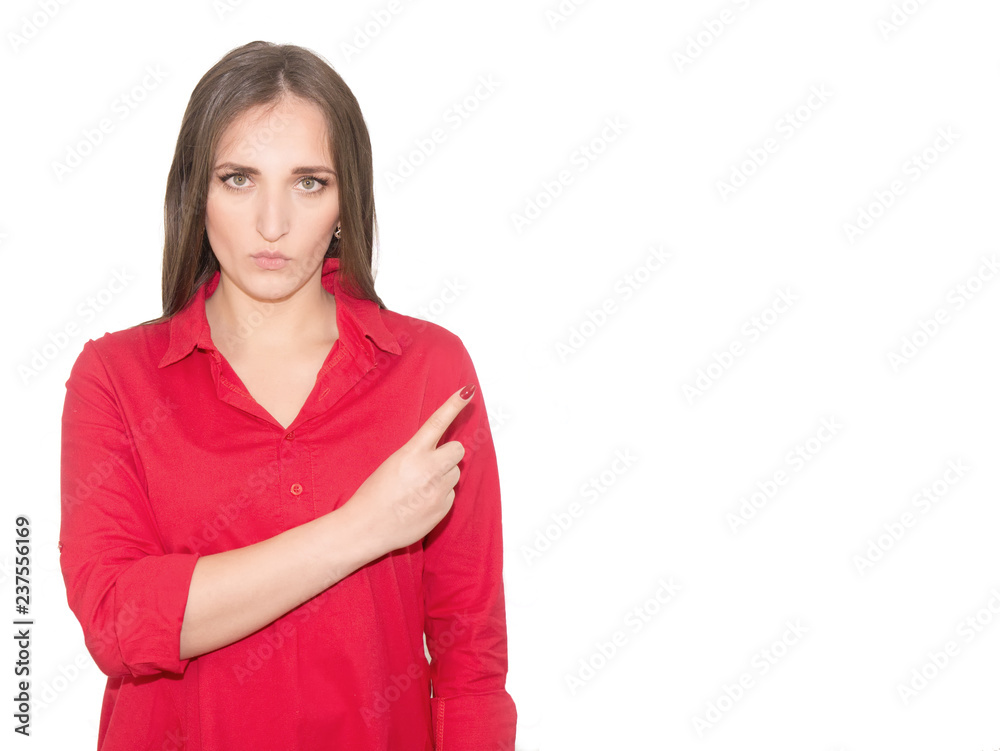 A young girl in a red shirt raises index finger and presses her lips. A woman finds a way out of trouble. The concept of emergency solution. Isolated on a white background A young girl in a red shirt raises index finger and presses her lips. A woman finds a way out of trouble. The concept of emergency solution. Isolated on a white background