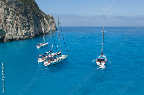  A group of sailing yachts stand in the bay.