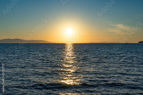 Seascape with beautiful sunset and sunset on the horizon. © vvicca