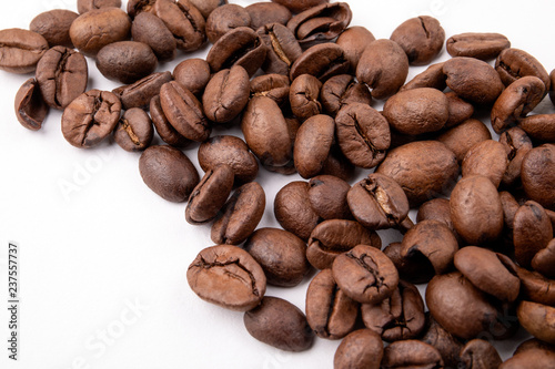 Coffee beans on white background close up.