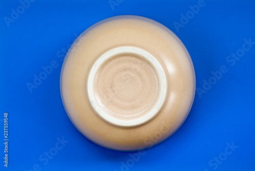  the circle from the bottom of the beige ceramic is isolated in blue