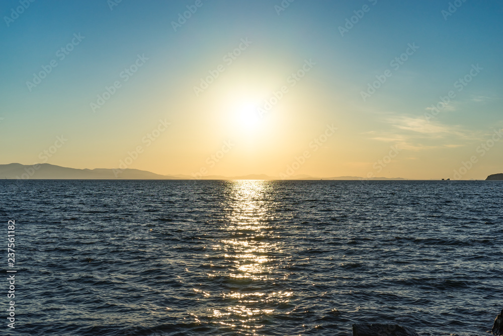 Seascape with beautiful sunset and sunset on the horizon.