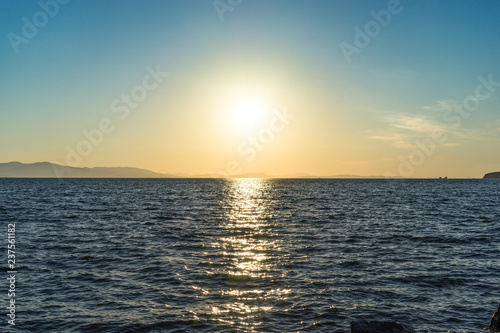 Seascape with beautiful sunset and sunset on the horizon.