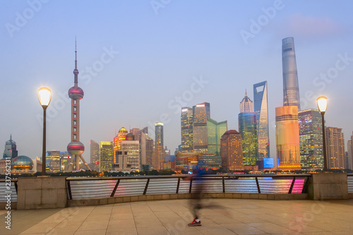 Photography Jogging man, illuminated Shanghai cityscape