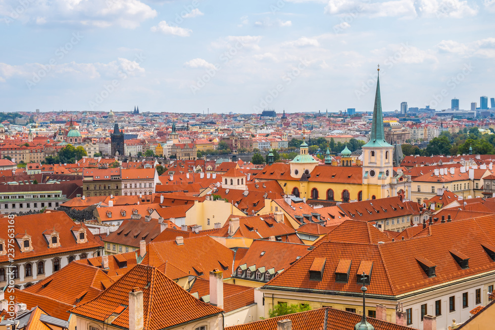 Obraz premium View over historic center of Prague with castle Prague city panorama, red roofs of Prague, Czech Republic