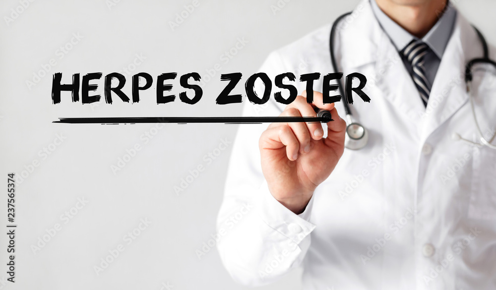 Doctor writing word HERPES ZOSTER with marker, Medical concept Doctor writing word HERPES ZOSTER with marker, Medical concept