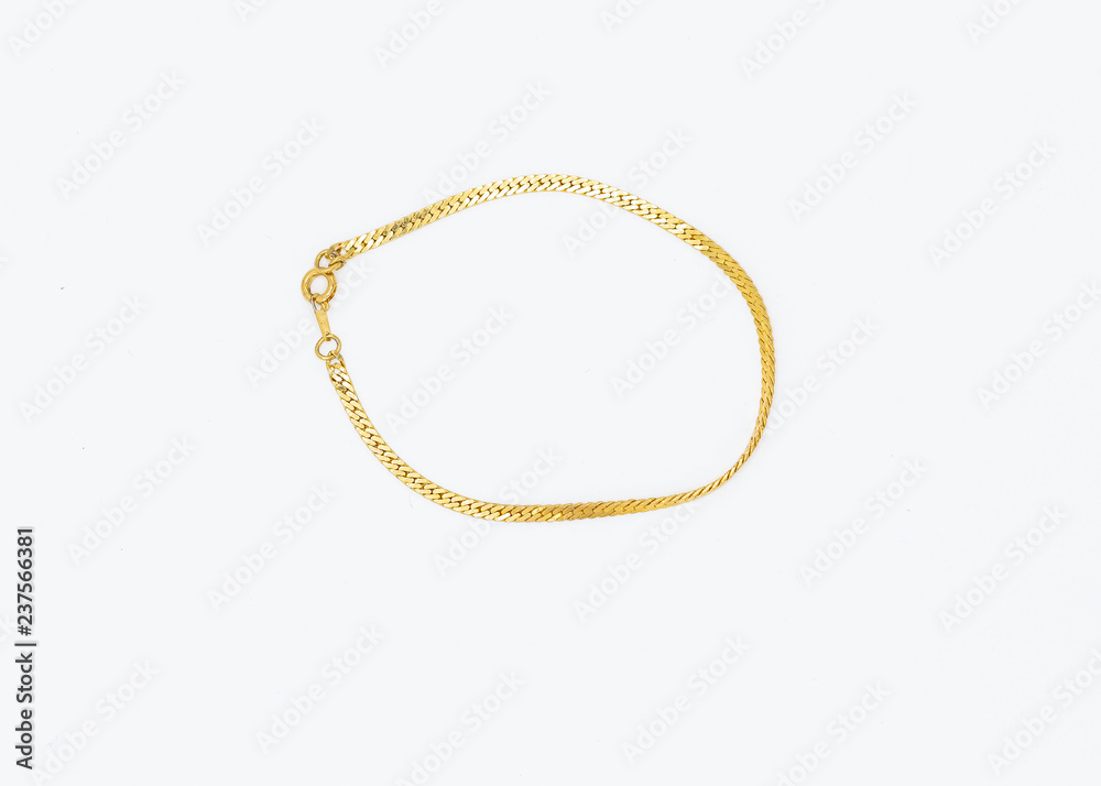 narrow gold metal bracelet made with very small links