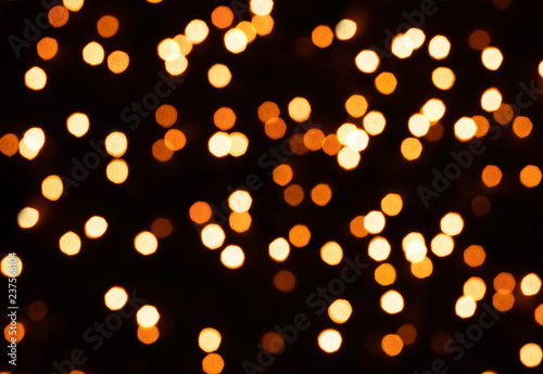 Glitter lights background. Holiday bokeh texture. Multicolored light. Defocused. Christmas background